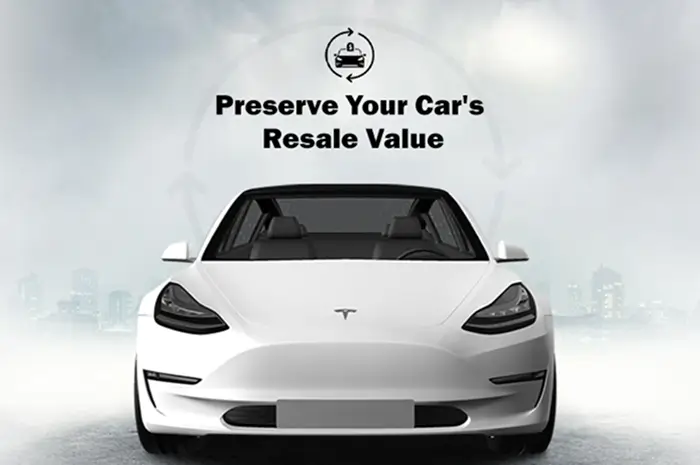 Front view of a white Tesla Model 3 with a clean, glossy exterior and text reading "Preserve Your Car's Resale Value."